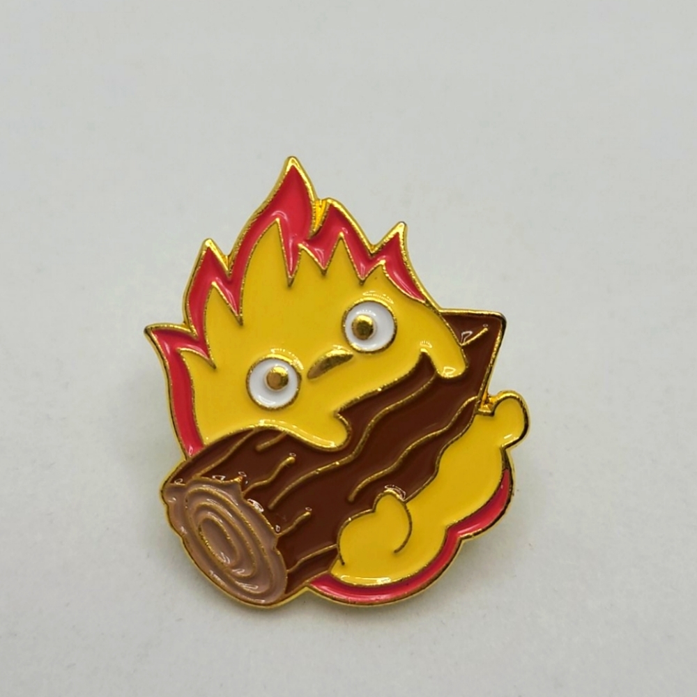 Pin: Calcifer anime with log, gold tone enamel pin